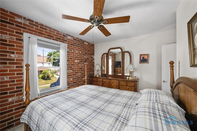 4526 Commonwealth Ave, Toledo, OH 43612 - bedroom with brick wall and a ceiling fan