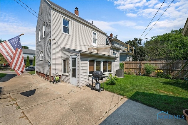 4526 Commonwealth Ave, Toledo, OH 43612 - back of house featuring a patio and a chimney