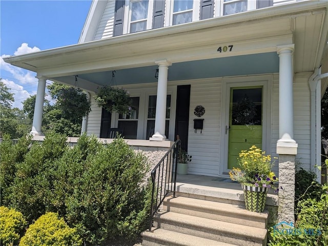 407 E Dudley St, Maumee, OH 43537 - view of exterior entry featuring a porch