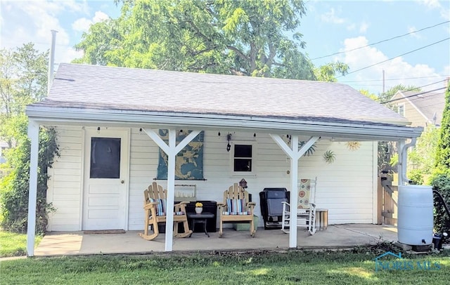 407 E Dudley St, Maumee, OH 43537 - rear view of property featuring a patio area and a shingled roof