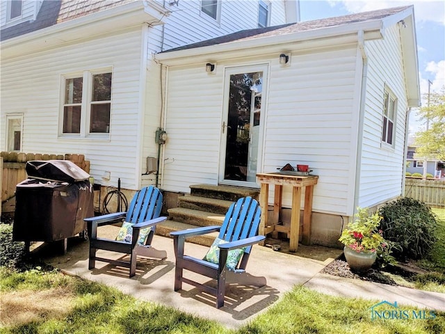 407 E Dudley St, Maumee, OH 43537 - rear view of house featuring entry steps, a shingled roof, and a patio area