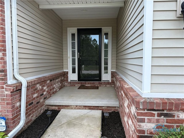 813 Meadowchase Ln, Toledo, OH 43615 - property entrance featuring brick siding