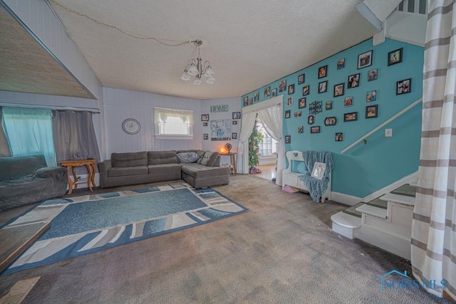 138 Boone Ave, Marion, OH 43302 - living area with a textured ceiling, a chandelier, carpet floors, and stairs