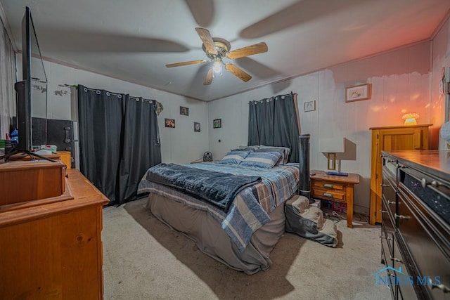 138 Boone Ave, Marion, OH 43302 - bedroom with light colored carpet and a ceiling fan