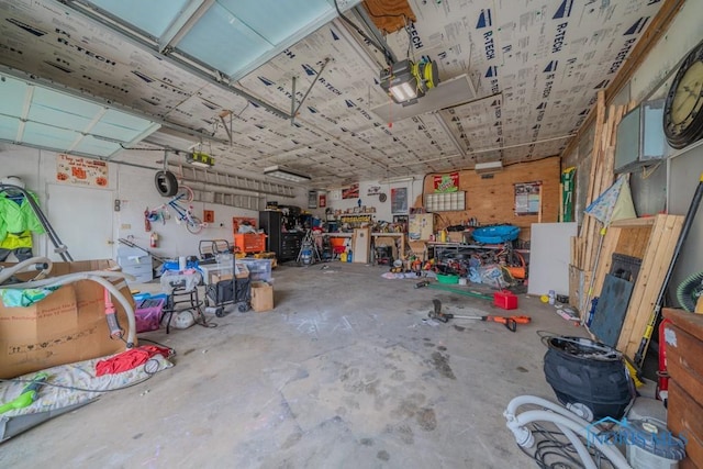 138 Boone Ave, Marion, OH 43302 - garage featuring a workshop area and a garage door opener