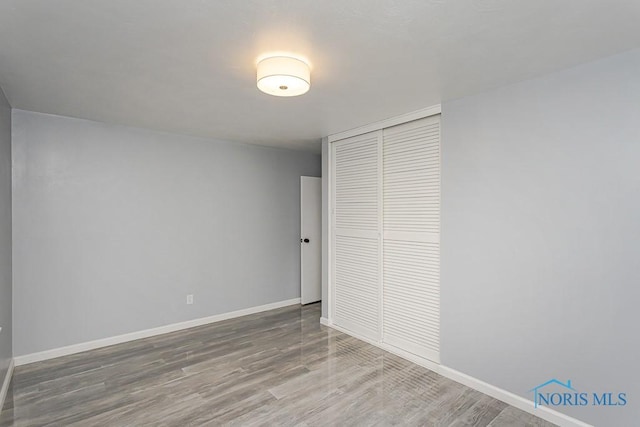 2617 Schroeder St, Toledo, OH 43613 - unfurnished bedroom featuring a closet and wood finished floors