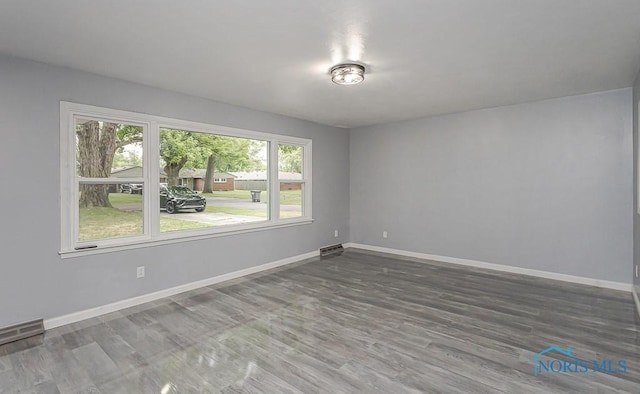 2617 Schroeder St, Toledo, OH 43613 - spare room with baseboards and wood finished floors