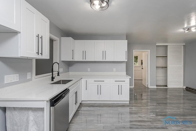 2617 Schroeder St, Toledo, OH 43613 - kitchen with dishwasher, light countertops, and white cabinetry