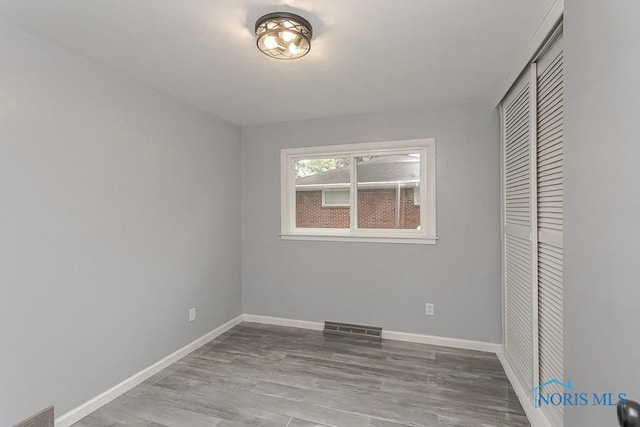 2617 Schroeder St, Toledo, OH 43613 - unfurnished bedroom with a closet and wood finished floors