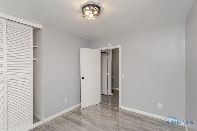 2617 Schroeder St, Toledo, OH 43613 - unfurnished bedroom with wood finished floors and a closet