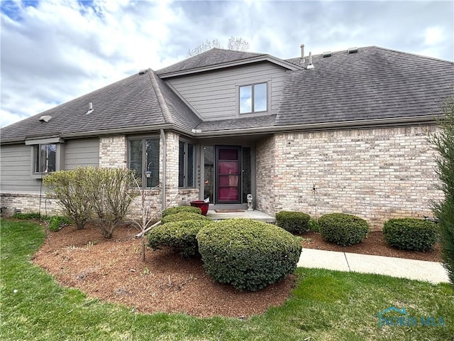 7361 Caracole Ct Unit 7361, Sylvania, OH 43560 - view of front of home featuring a shingled roof and brick siding