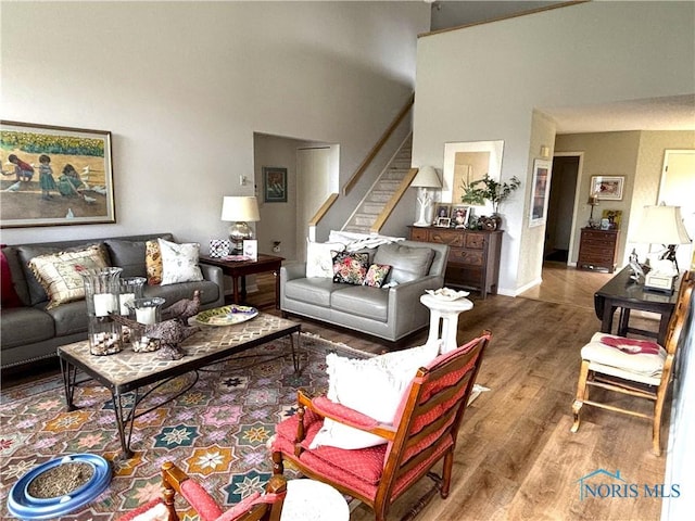 7361 Caracole Ct Unit 7361, Sylvania, OH 43560 - living room with a high ceiling, wood finished floors, and stairs