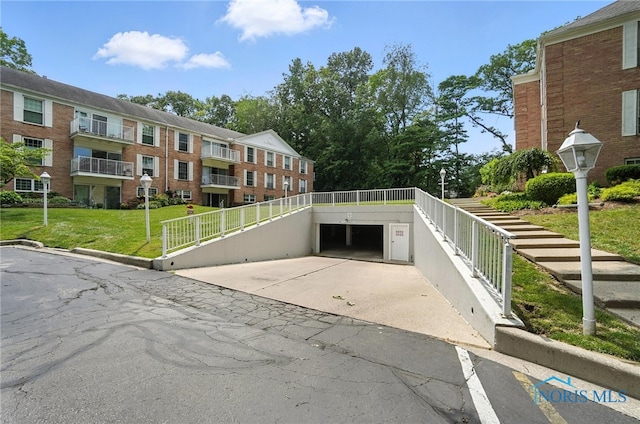 5679 Monroe St Unit 410, Sylvania, OH 43560 - surrounding community featuring driveway, a yard, and a garage