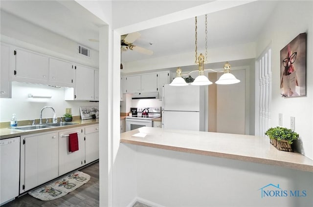 5679 Monroe St Unit 410, Sylvania, OH 43560 - kitchen with white appliances, under cabinet range hood, white cabinets, ceiling fan, and light countertops