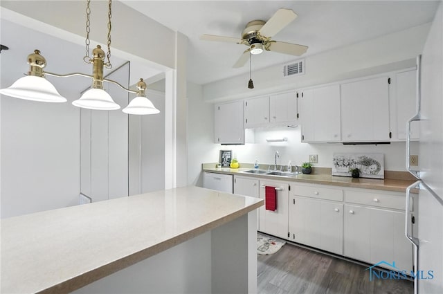 5679 Monroe St Unit 410, Sylvania, OH 43560 - kitchen featuring white dishwasher, white cabinets, ceiling fan, and light countertops