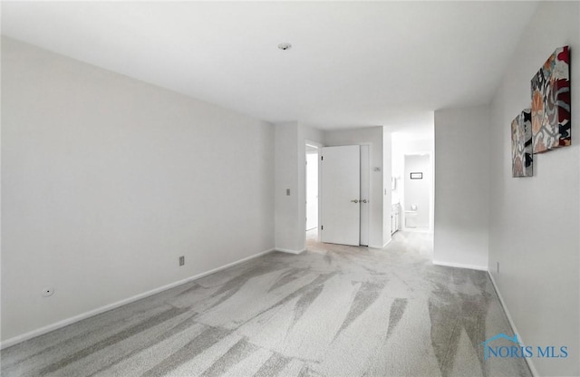 5679 Monroe St Unit 410, Sylvania, OH 43560 - unfurnished room featuring light carpet and baseboards