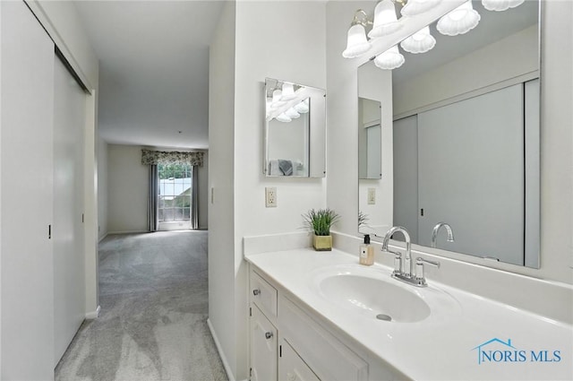 5679 Monroe St Unit 410, Sylvania, OH 43560 - bathroom featuring vanity and a chandelier