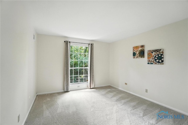 5679 Monroe St Unit 410, Sylvania, OH 43560 - carpeted empty room with baseboards