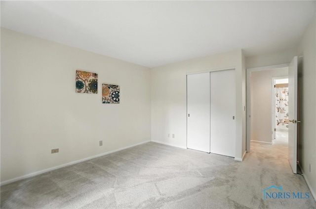 5679 Monroe St Unit 410, Sylvania, OH 43560 - unfurnished bedroom featuring light carpet and a closet