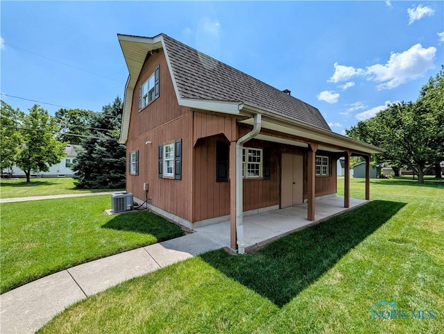 309 Buckeye St, Archbold, OH 43502 - view of home's exterior featuring a shingled roof and a lawn
