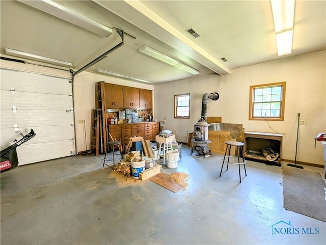 309 Buckeye St, Archbold, OH 43502 - garage with a wood stove