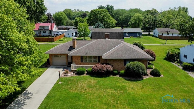 309 Buckeye St, Archbold, OH 43502 - ranch-style home with a garage, brick siding, a front yard, a chimney, and driveway