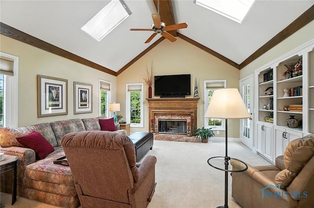 5576 N Citation Rd, Ottawa Hills, OH 43615 - living room with a skylight, a high end fireplace, light colored carpet, and ceiling fan