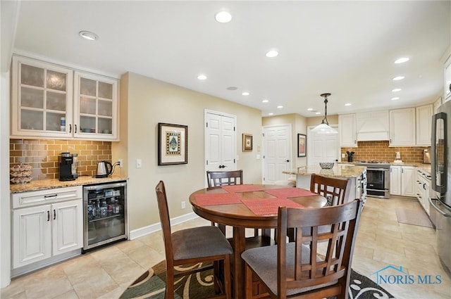 5576 N Citation Rd, Ottawa Hills, OH 43615 - dining room featuring beverage cooler, recessed lighting, and light tile patterned flooring