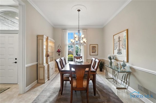 5576 N Citation Rd, Ottawa Hills, OH 43615 - dining space featuring a chandelier, crown molding, and light tile patterned floors