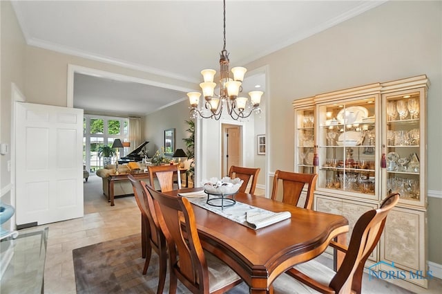 5576 N Citation Rd, Ottawa Hills, OH 43615 - dining room with crown molding and a chandelier