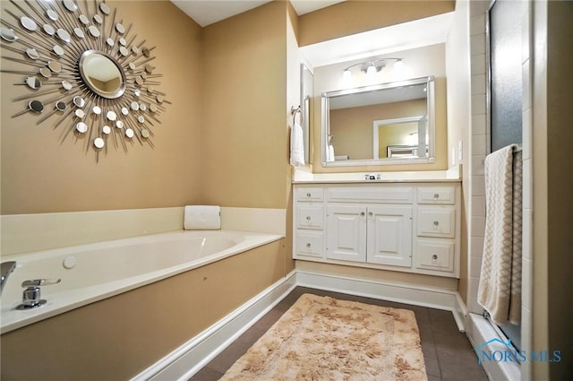 5576 N Citation Rd, Ottawa Hills, OH 43615 - bathroom featuring vanity, a bath, and tile patterned flooring