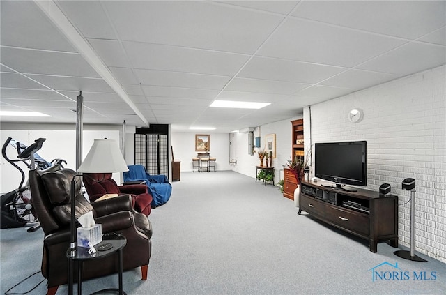 5576 N Citation Rd, Ottawa Hills, OH 43615 - living room featuring a paneled ceiling, carpet floors, and brick wall