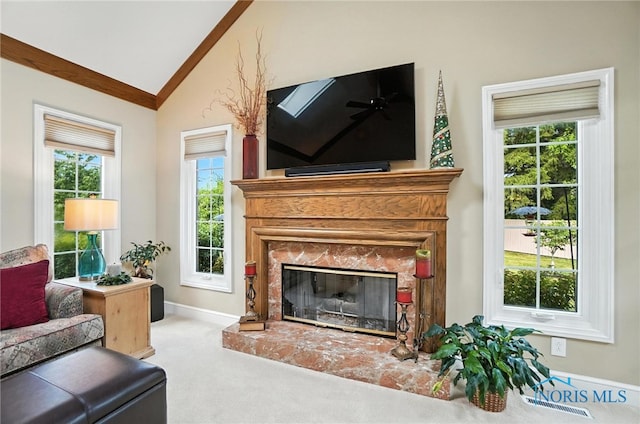5576 N Citation Rd, Ottawa Hills, OH 43615 - carpeted living room featuring vaulted ceiling and a premium fireplace