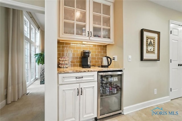 5576 N Citation Rd, Ottawa Hills, OH 43615 - indoor bar featuring beverage cooler, tasteful backsplash, and light colored carpet