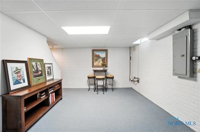 5576 N Citation Rd, Ottawa Hills, OH 43615 - finished basement with brick wall, electric panel, and a drop ceiling