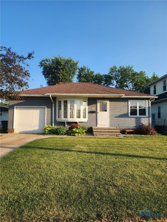 208 E Union St, Walbridge, OH 43465 - ranch-style home featuring an attached garage, a front yard, and concrete driveway