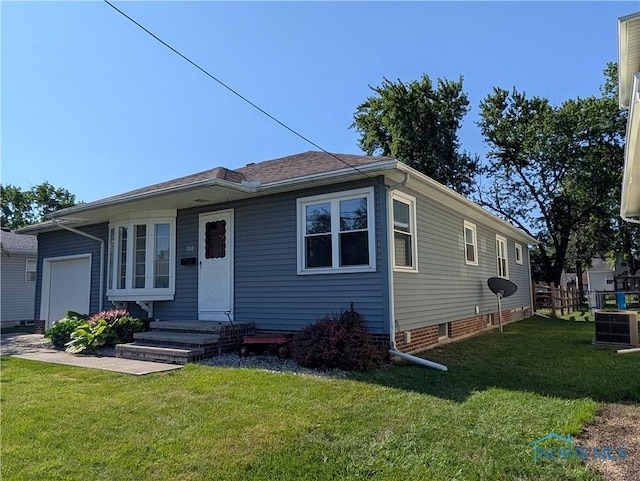 208 E Union St, Walbridge, OH 43465 - view of front of home with a garage, a front lawn, and crawl space