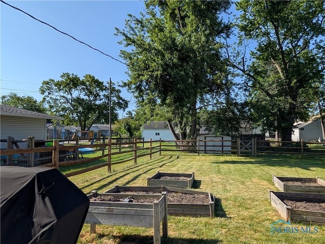 208 E Union St, Walbridge, OH 43465 - fenced backyard with a garden