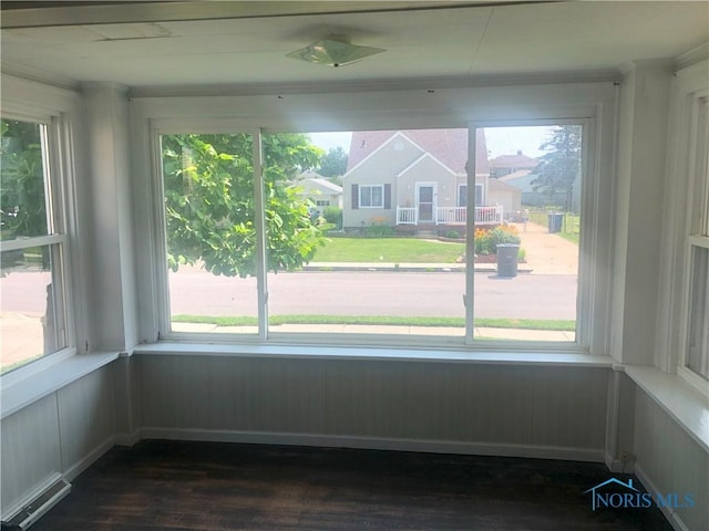 4815 298th St, Toledo, OH 43611 - unfurnished sunroom featuring wood finished floors, plenty of natural light, and ornamental molding