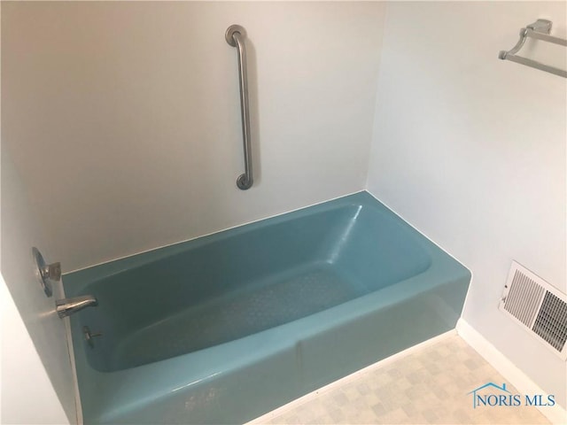 4815 298th St, Toledo, OH 43611 - bathroom with a bath and tile patterned floors
