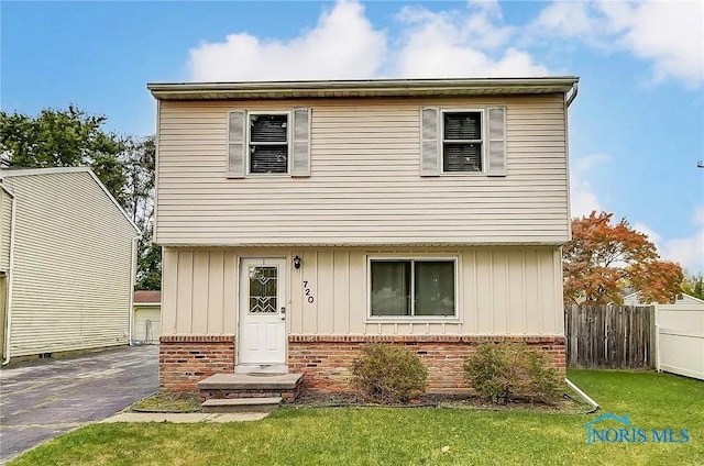 720 Butterfield Dr, Toledo, OH 43615 - view of front facade featuring brick siding and board and batten siding