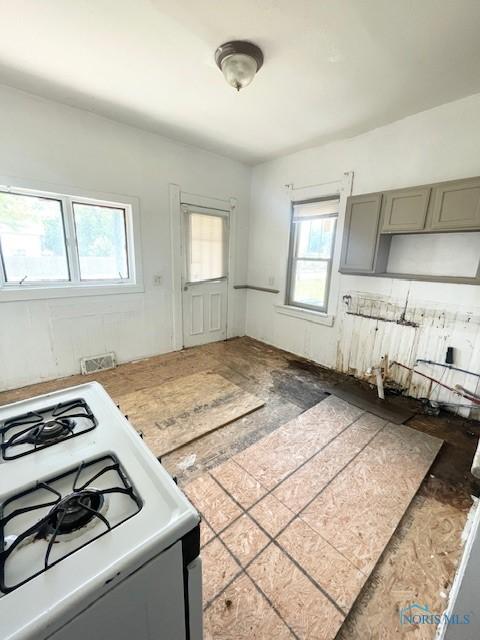 522 Oswald St, Toledo, OH 43605 - kitchen featuring white range with gas stovetop and gray cabinets
