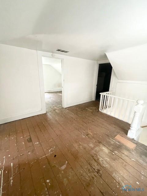 522 Oswald St, Toledo, OH 43605 - additional living space featuring hardwood / wood-style flooring and lofted ceiling