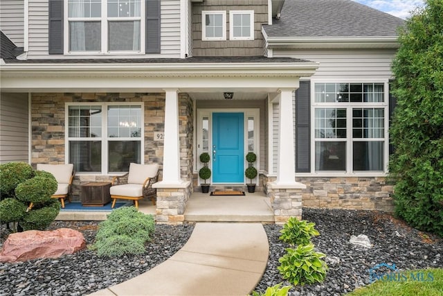 9258 Nate Ct, Sylvania, OH 43560 - entrance to property with a porch, stone siding, and roof with shingles