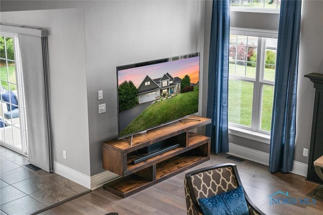 9258 Nate Ct, Sylvania, OH 43560 - living area featuring baseboards and wood finished floors