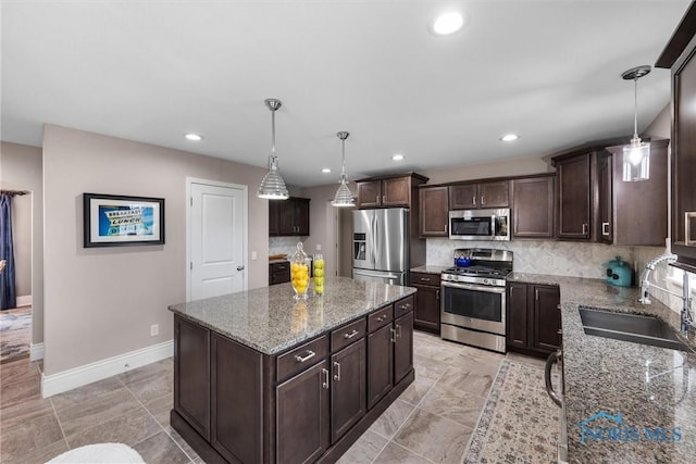 9258 Nate Ct, Sylvania, OH 43560 - kitchen featuring stainless steel appliances, dark brown cabinetry, tasteful backsplash, stone countertops, and recessed lighting
