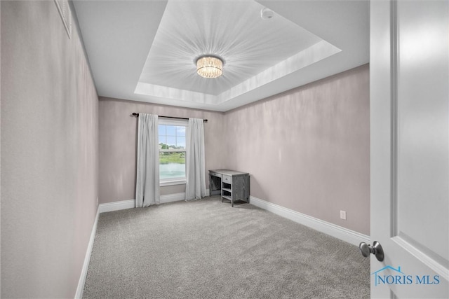 9258 Nate Ct, Sylvania, OH 43560 - spare room featuring carpet flooring and a tray ceiling