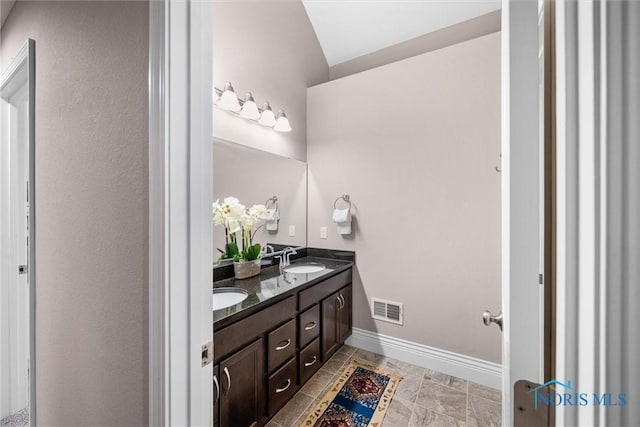 9258 Nate Ct, Sylvania, OH 43560 - full bath featuring double vanity and baseboards