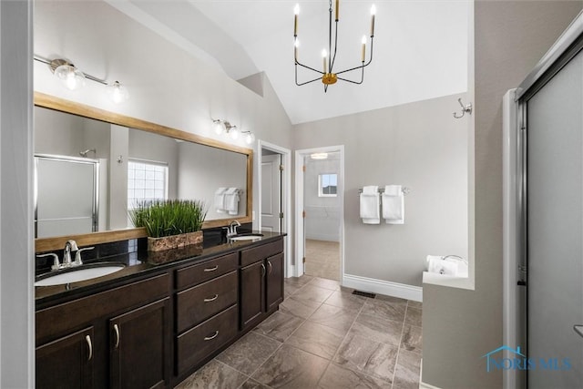 9258 Nate Ct, Sylvania, OH 43560 - full bath featuring vaulted ceiling, a stall shower, a chandelier, and double vanity