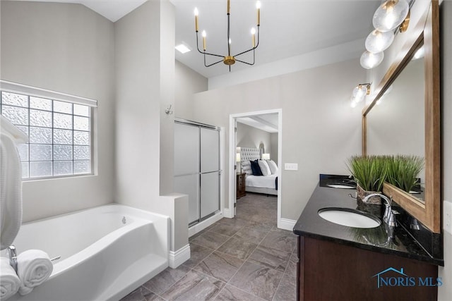 9258 Nate Ct, Sylvania, OH 43560 - full bathroom featuring a garden tub, double vanity, a stall shower, a chandelier, and connected bathroom